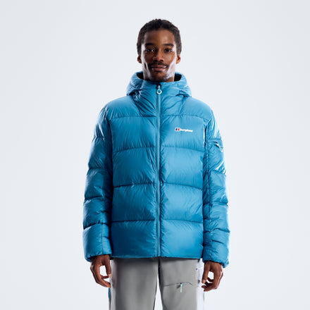 Men's blue hooded down jacket on model, front zip and baffle quilting.