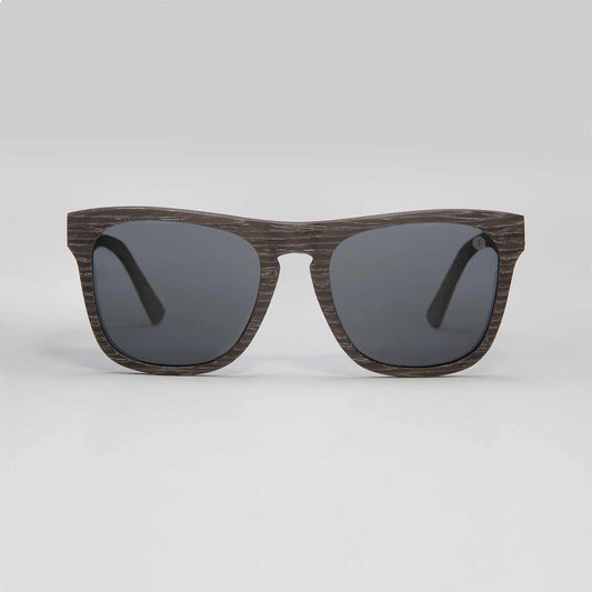 Polarized sunglasses with dark woodgrain frame and black lenses.