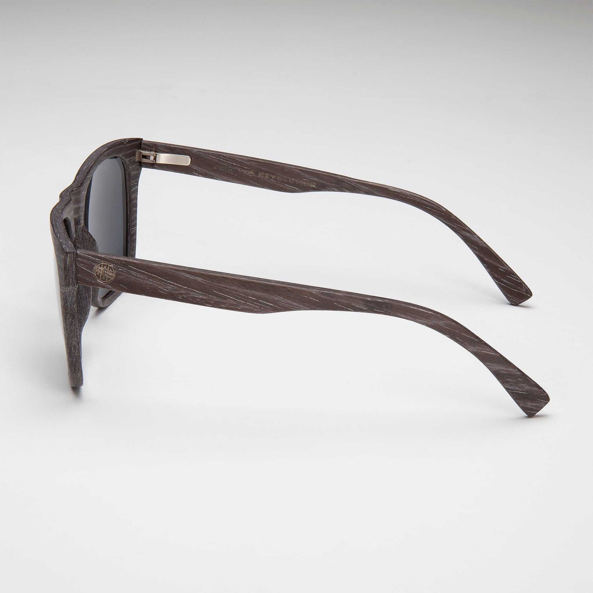 Black wood-look sunglasses side view with slender curved temple arms