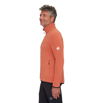Men's light fleece jacket in orange, side view with sleeve logo and zip pocket