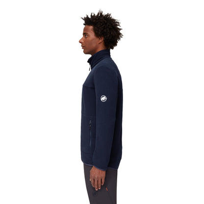 Men's light fleece jacket on model, dark navy side view with logo patch