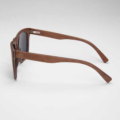 Polarized sunglasses side view with slim wood-tone frame and silver hinge