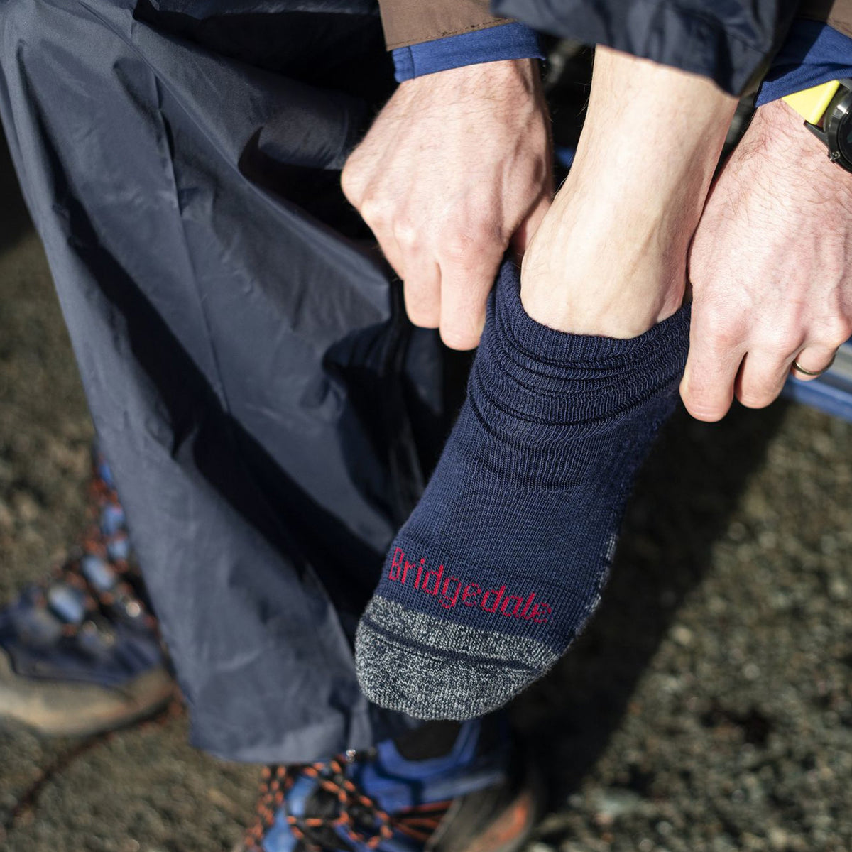 Dark navy and grey merino hiking boot socks with red Bridgedale logo