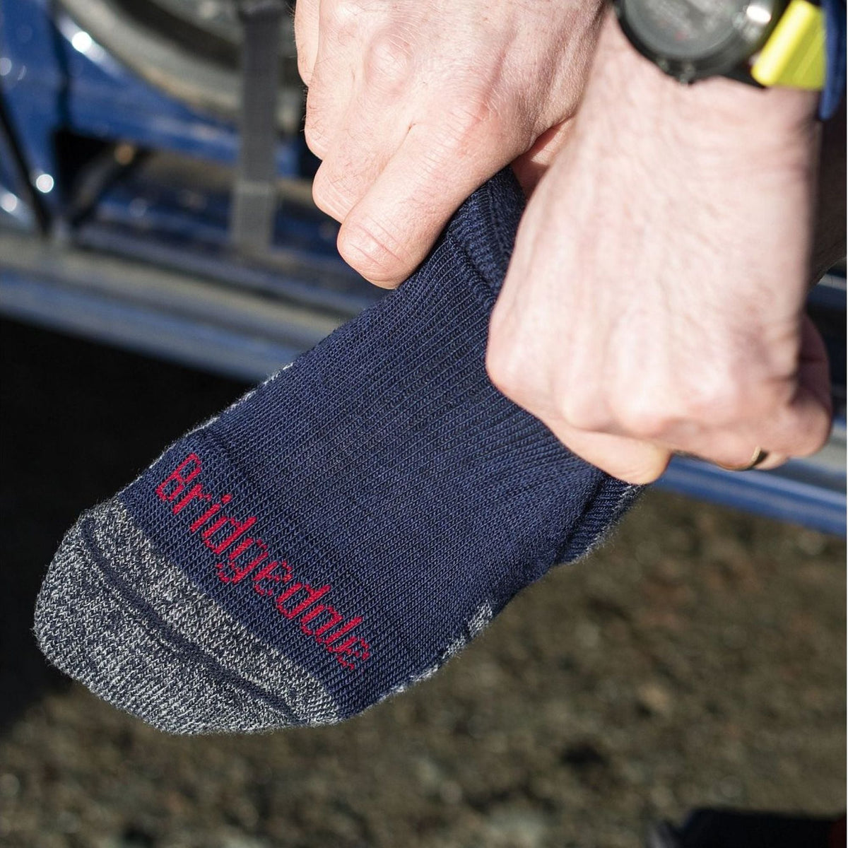 Navy merino hiking boot socks with grey toe and heel, red Bridgedale lettering