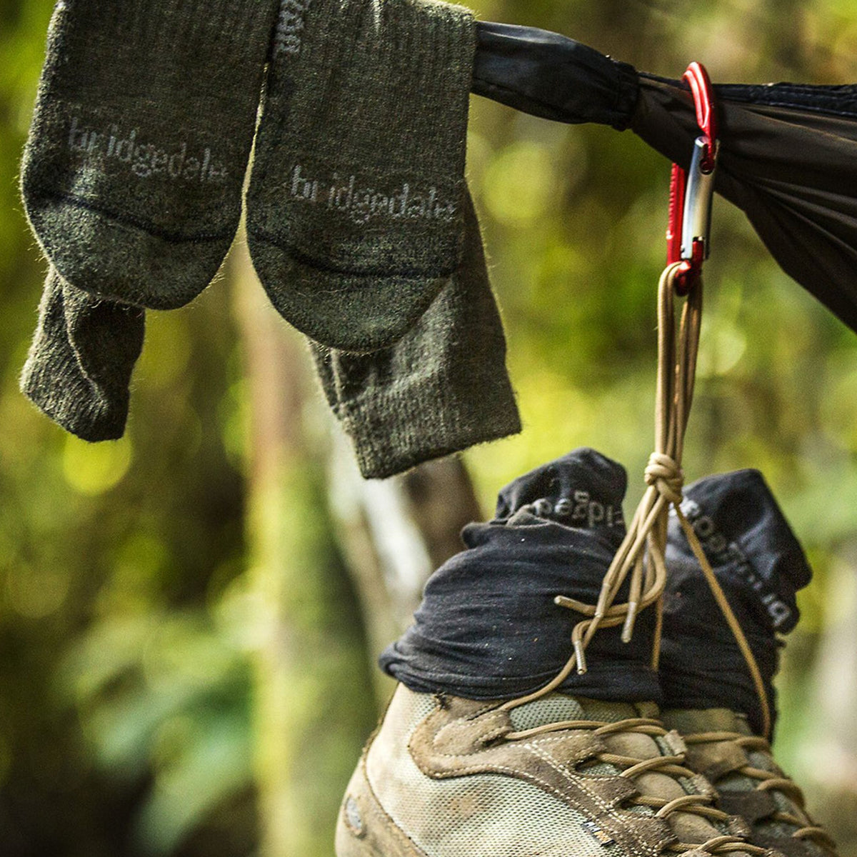 Green hiking boot socks with Bridgedale logo, worn with hiking boots