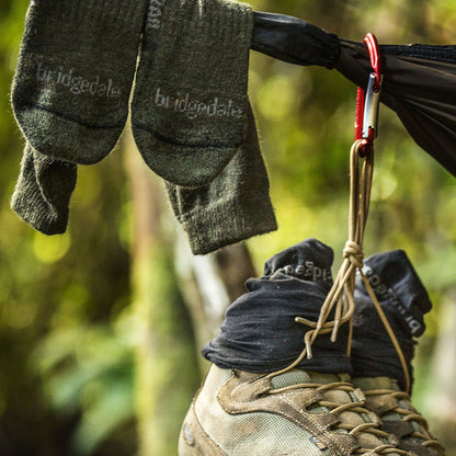 Green hiking boot socks with Bridgedale logo, worn with hiking boots