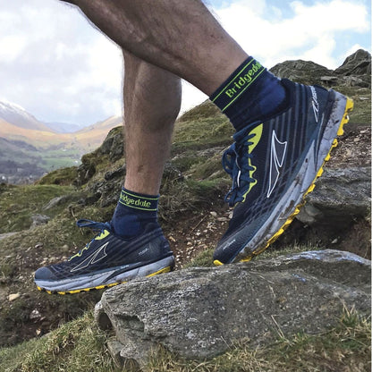 Men's blue crew trail socks with green Bridgedale logo