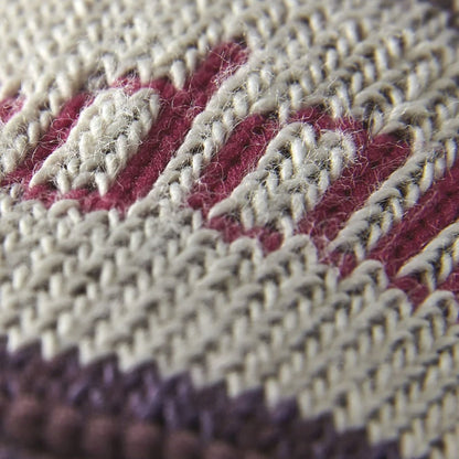 Close-up knit of plum hiking boot socks with light contrast panels.
