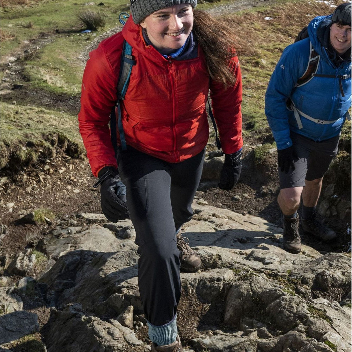 Ladies blue merino wool boot socks worn with trekking pants and hiking shoes