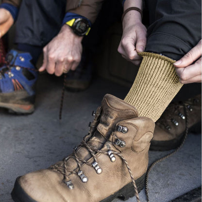 Ladies natural beige merino wool boot socks pulled up on hiking boots