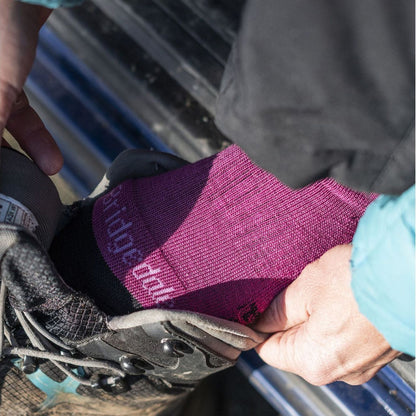 Berry merino hiking boot socks worn with boots, black toe and heel