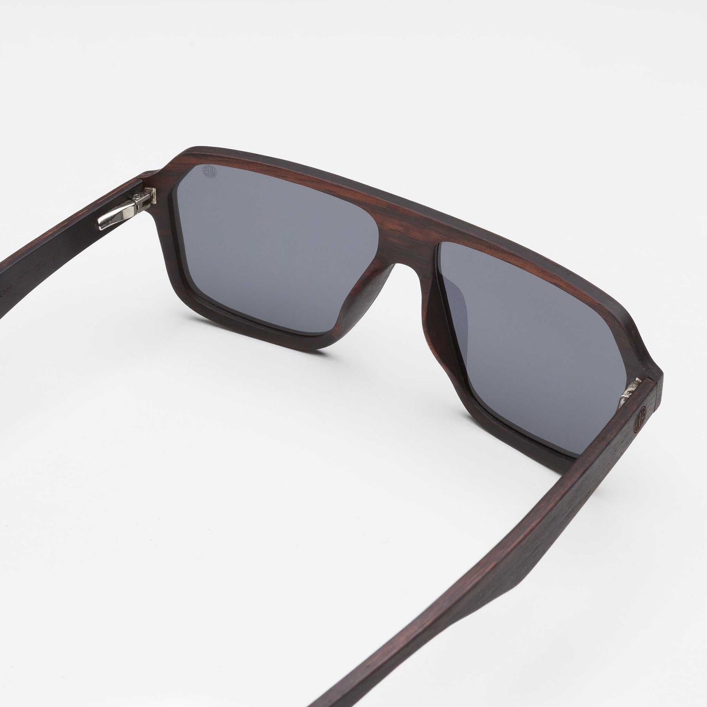Mavericks sunglasses angled view with gray lenses and dark wood-style frame