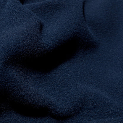 Navy fleece jacket fabric close-up with soft pile texture