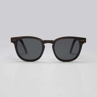 Round black sunglasses with dark lenses