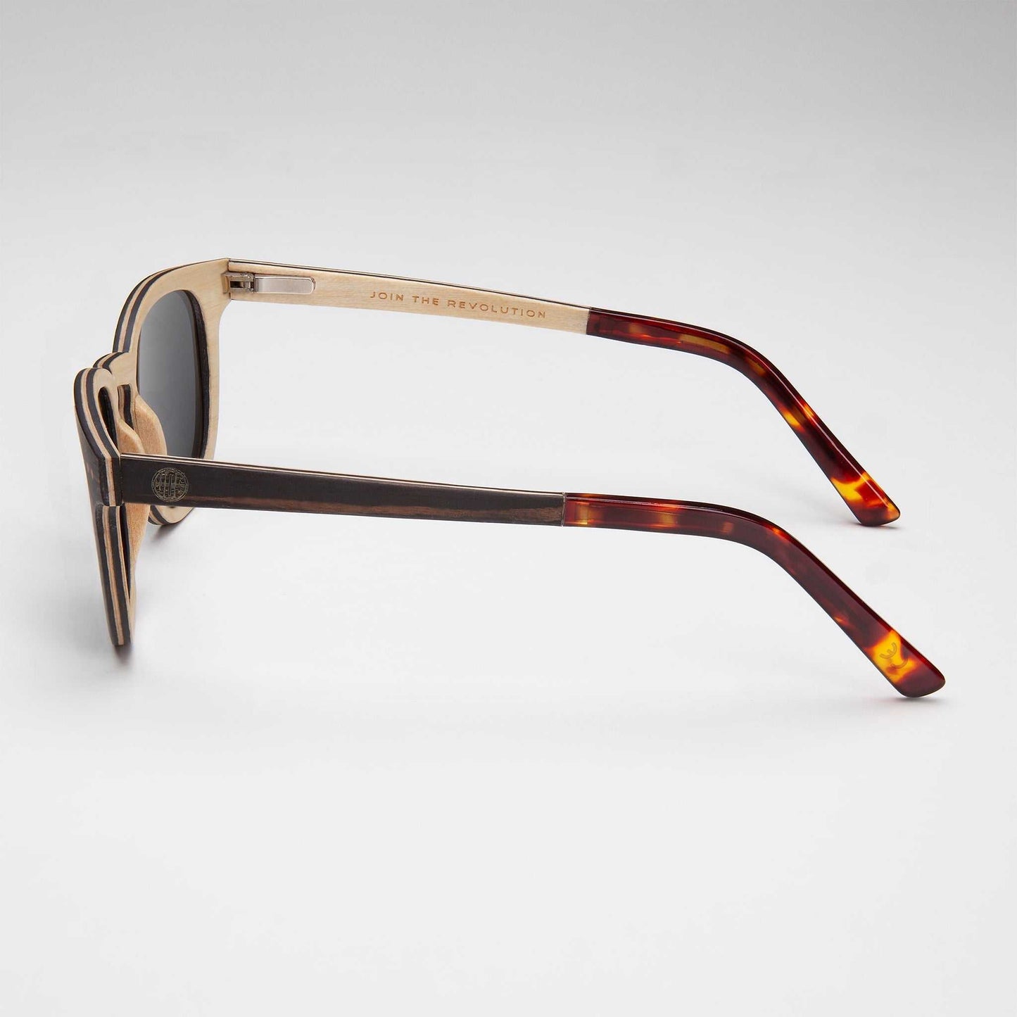 Sunglasses with dark lenses and tortoiseshell temple tips