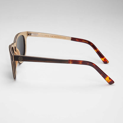 Sunglasses with dark lenses and tortoiseshell temple tips