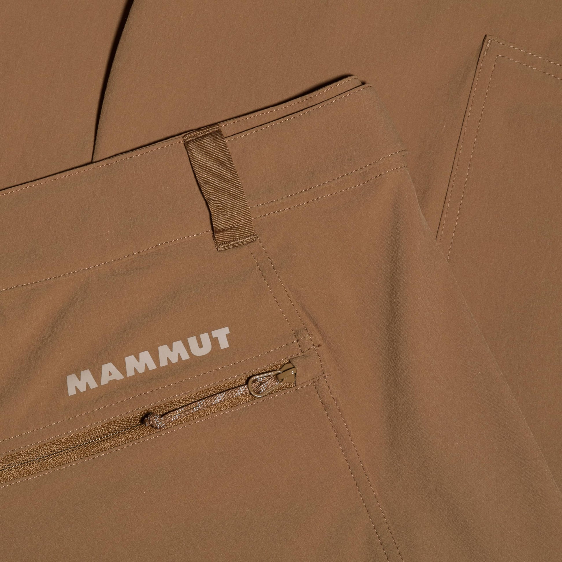 Men's trail running shorts, tan with Mammut logo and zip storage pocket