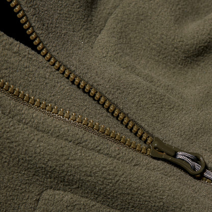 Lightweight fleece jacket zipper detail in olive-green with dark brown pull tab