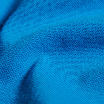 Bright blue knit T-shirt fabric close-up with fine textured weave