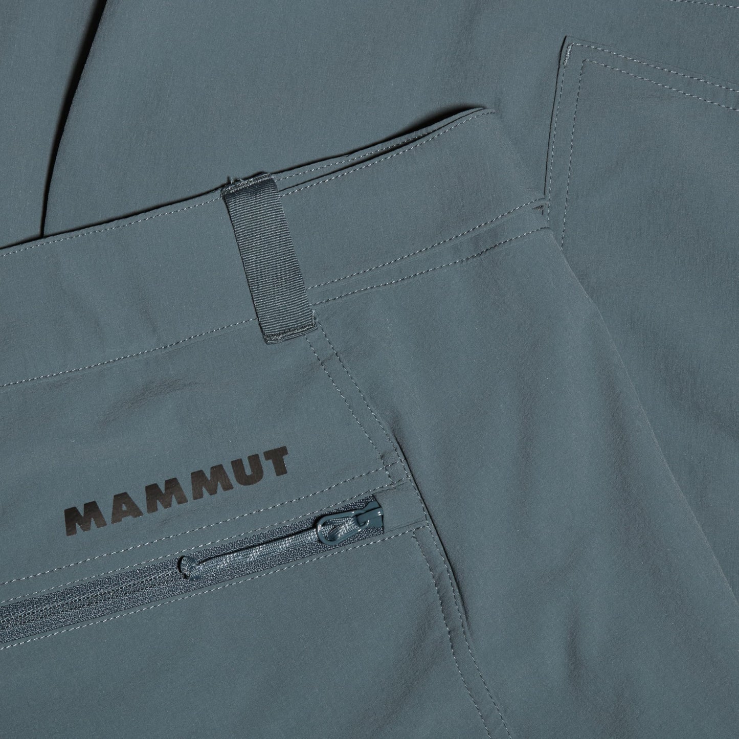 Men's trail running shorts, light gray with Mammut logo and front zipper pocket