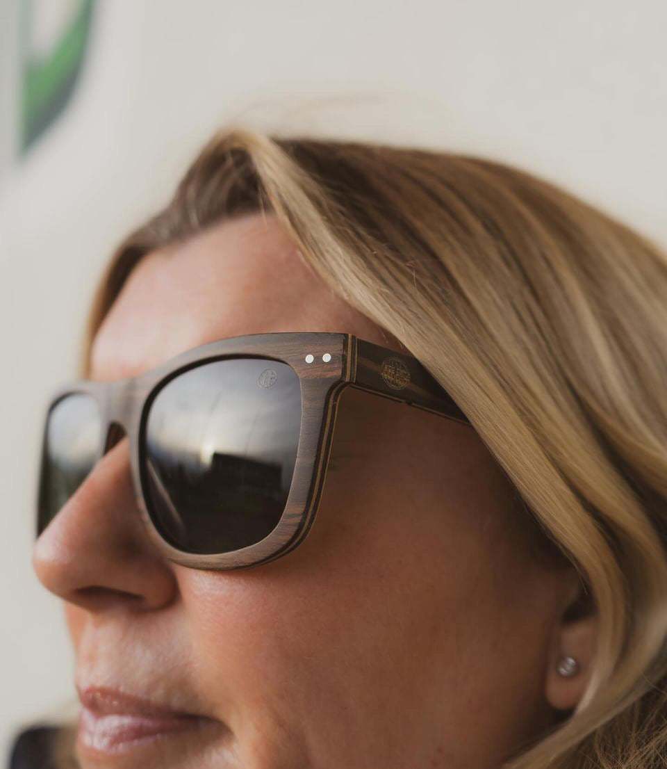 Dark-framed sunglasses with mirrored black lenses