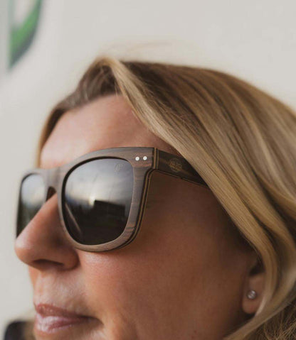 Dark-framed sunglasses with mirrored black lenses