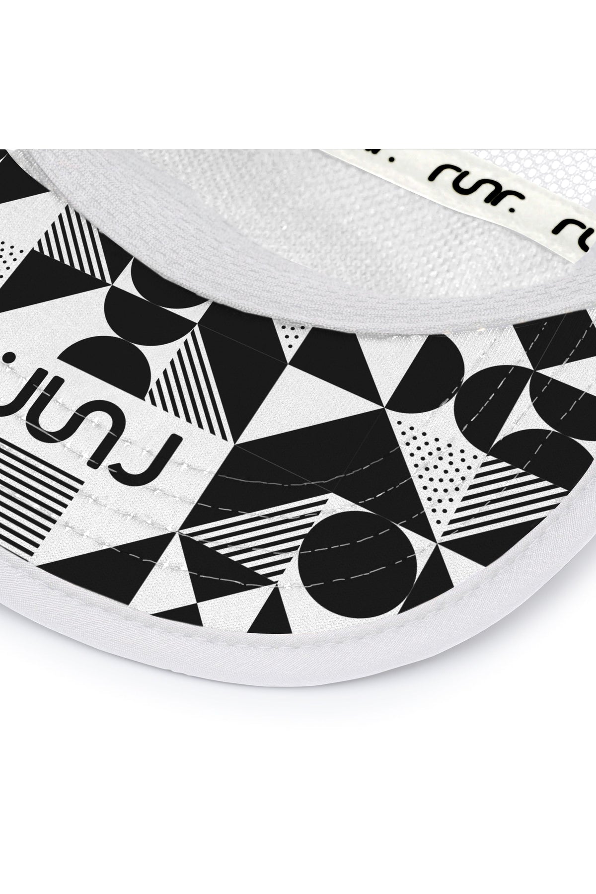 White running hat brim with black-and-white graphic print underside