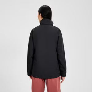 Person wearing a black jacket and red pants on a white background
