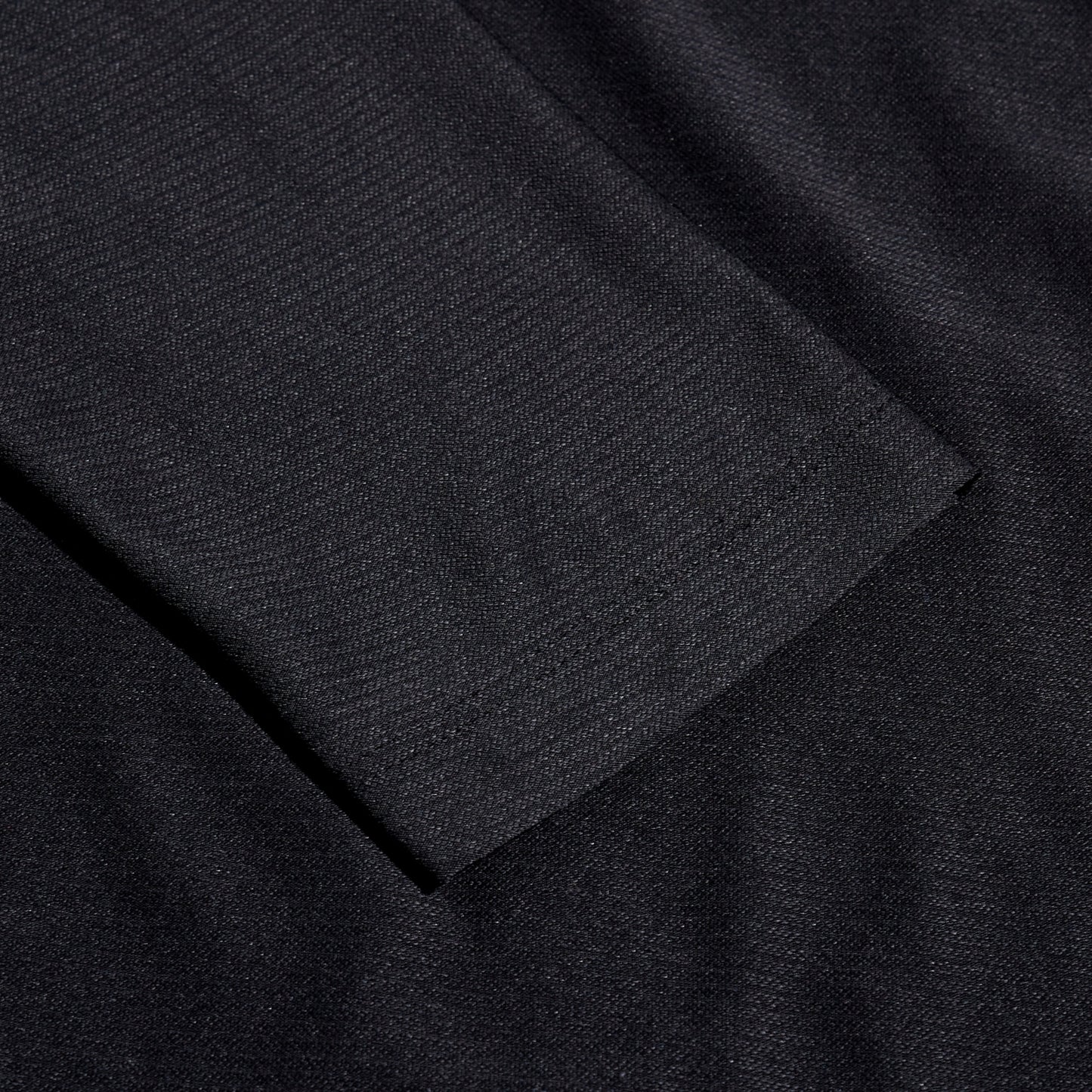 Close-up of black fabric with a textured pattern