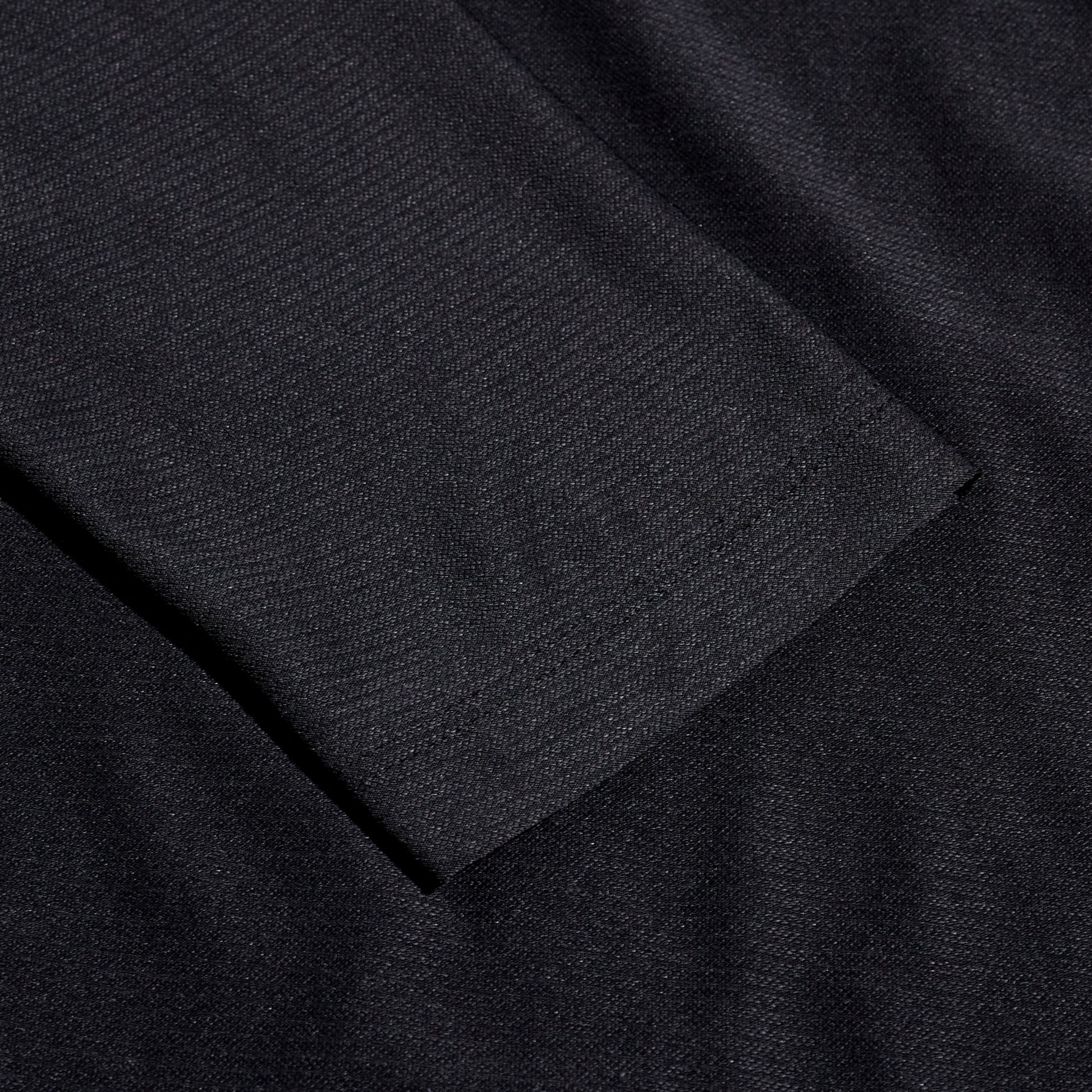 Close-up of black fabric with a textured pattern