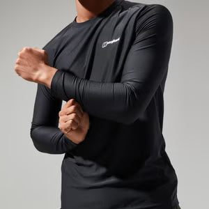 Person wearing a black long-sleeve athletic shirt with a brand logo on a gray background