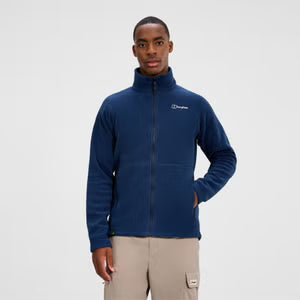 Man wearing a blue fleece jacket with a visible brand logo on a white background