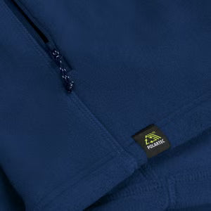 Close-up of a blue jacket with a visible brand label.