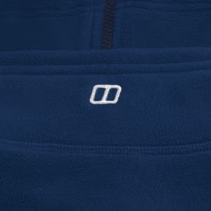 Close-up of a blue fleece jacket with a brand logo on the chest area.
