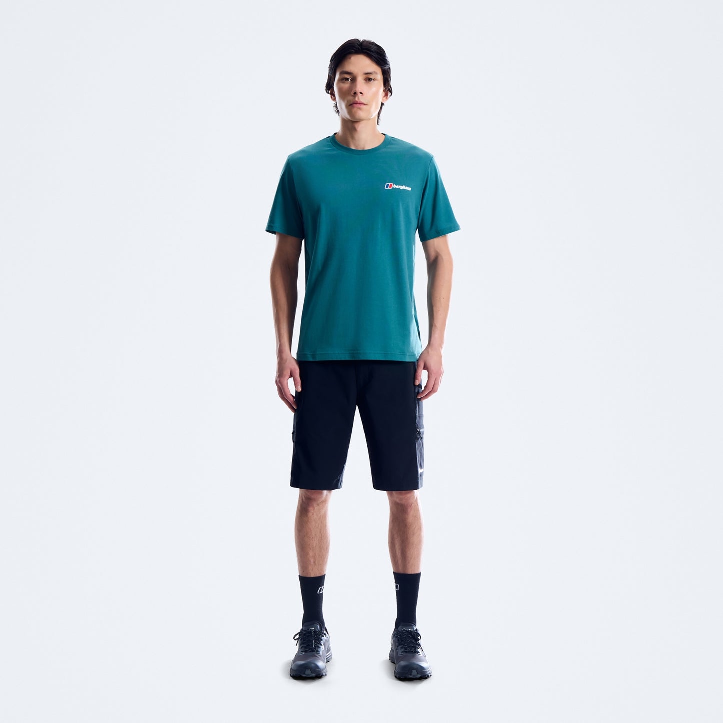 Men's teal Berghaus logo T-shirt on model, short sleeves