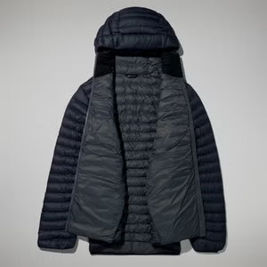 Dark gray puffer jacket with a hood on a light gray background