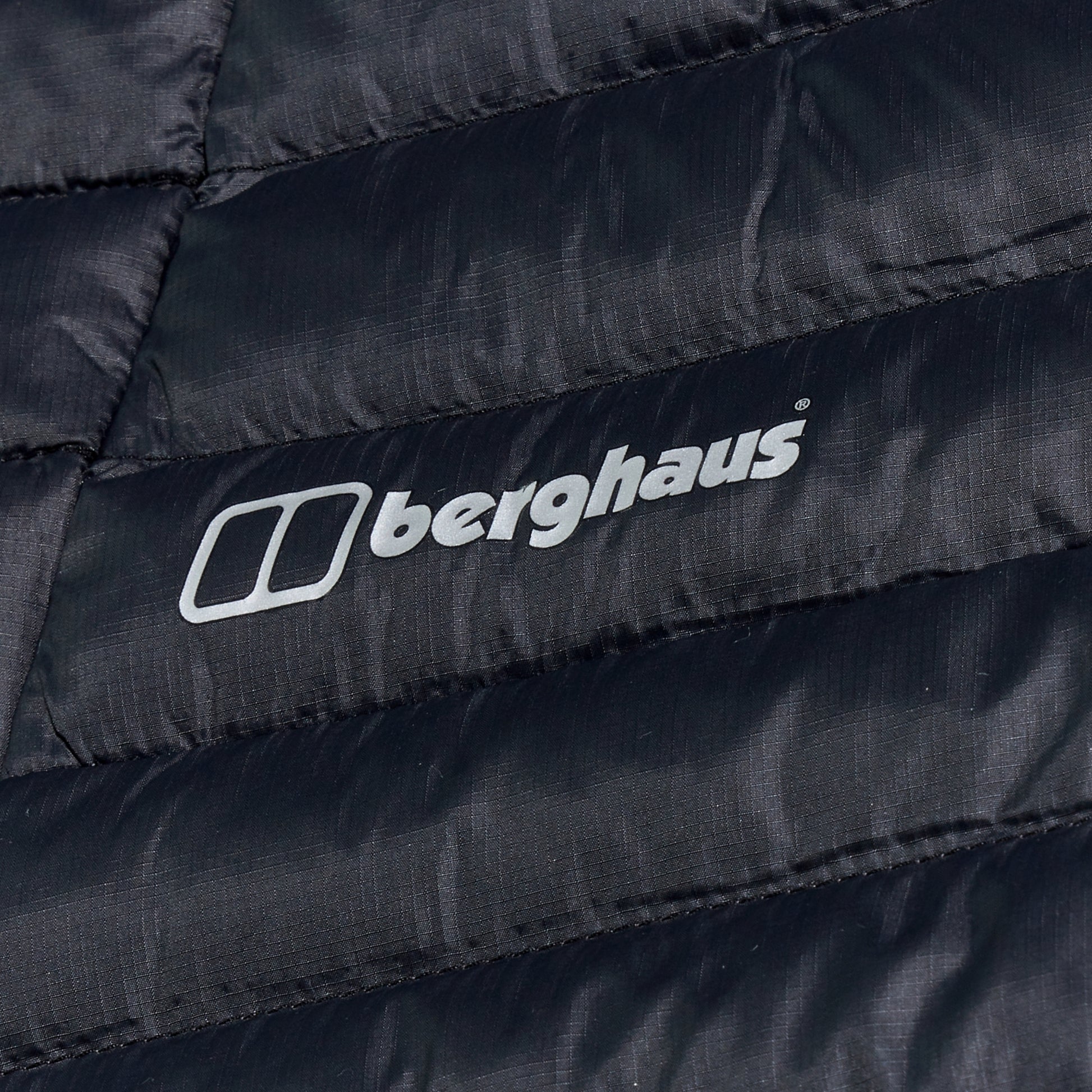 Close-up of a black Berghaus jacket with the brand logo.