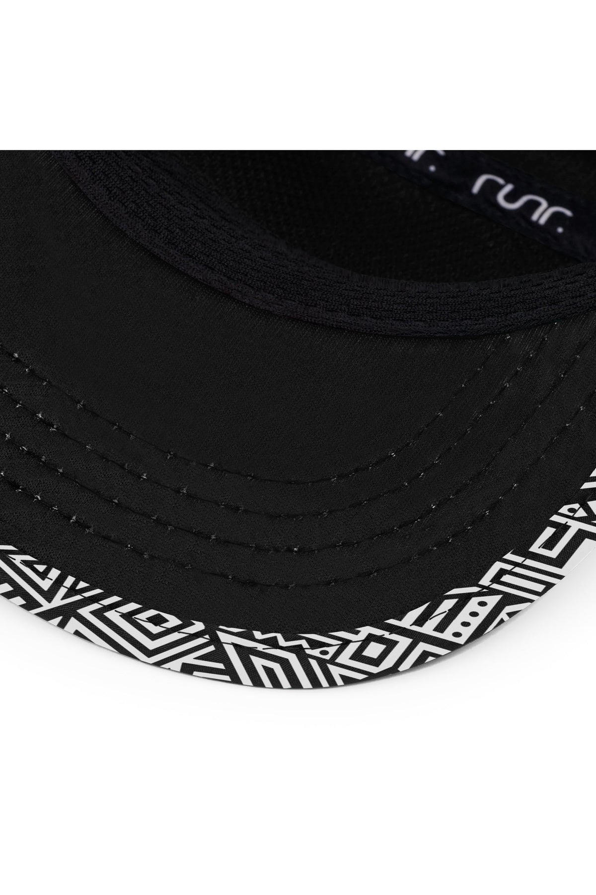 Close-up of black technical running hat brim with geometric panel and small logo