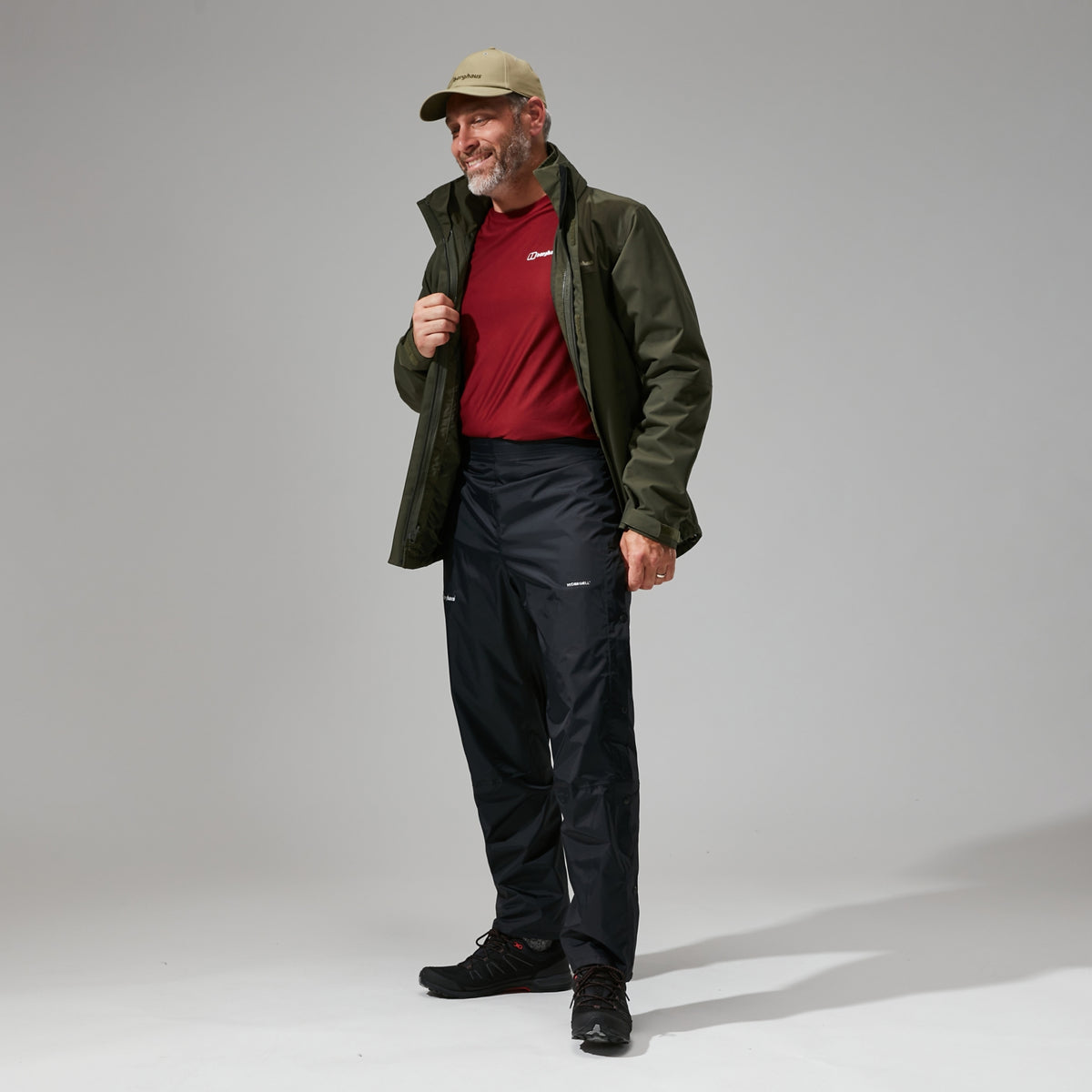 Black waterproof overtrousers with adjustable waistband and full-length legs