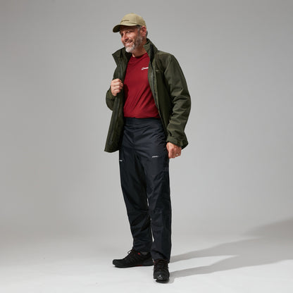 Black waterproof overtrousers with adjustable waistband and full-length legs