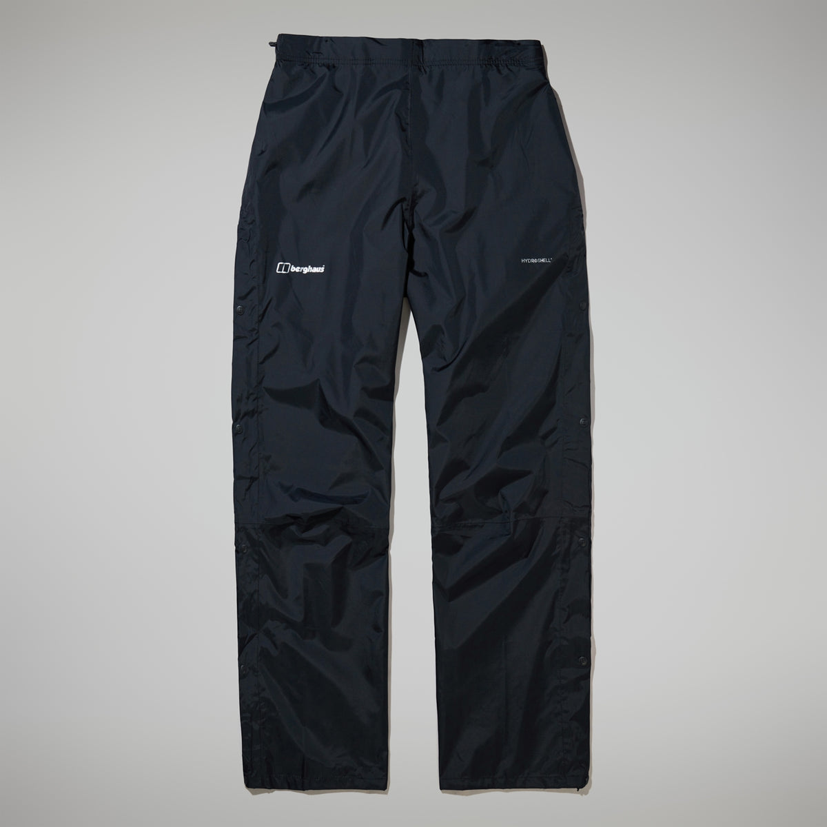 Black waterproof overtrousers, front view, elastic waistband and logo