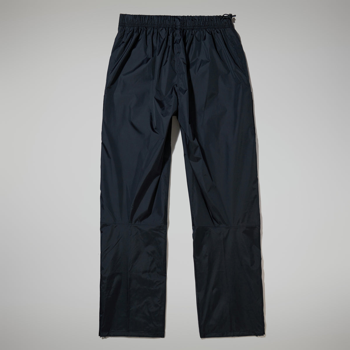 Black waterproof overtrousers, back view, elasticated cuffs and logo