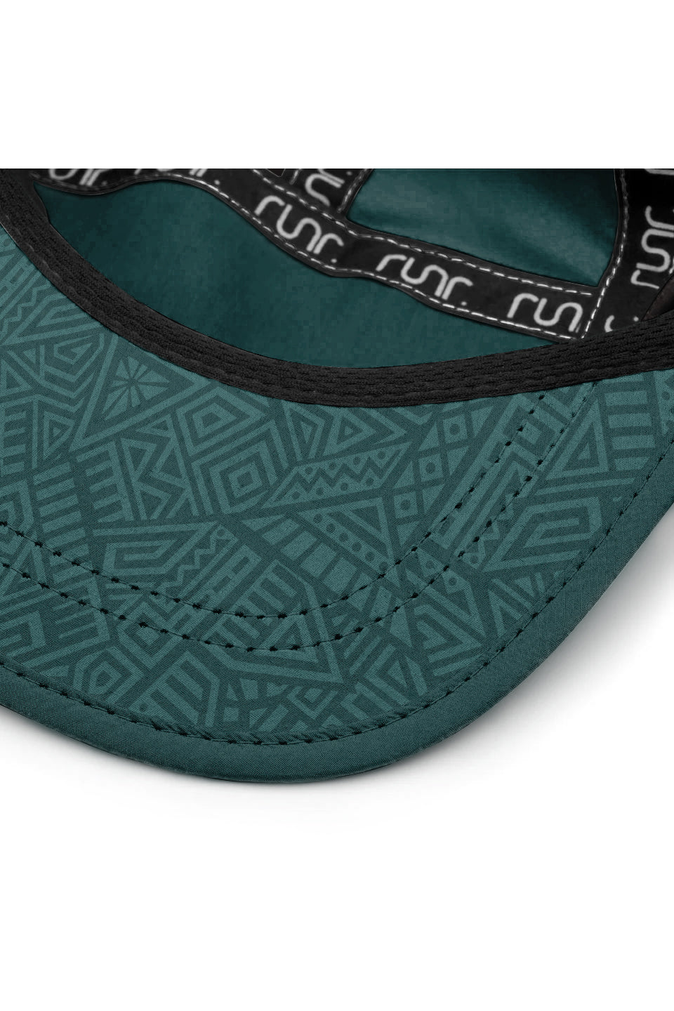 Technical running hat brim close-up with dark teal trim and patterned inner lining