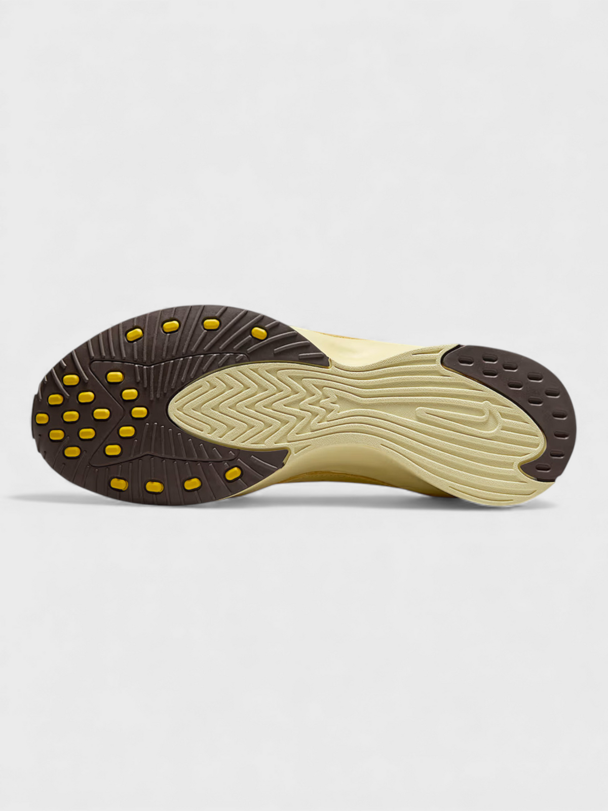 Soft yellow Nike Air outsole with rubber tread and studded edge grip.
