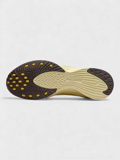 Soft yellow Nike Air outsole with rubber tread and studded edge grip.