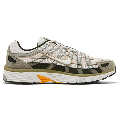 Nike P-6000 sneakers side view with mesh panels, lace-up, and orange accent