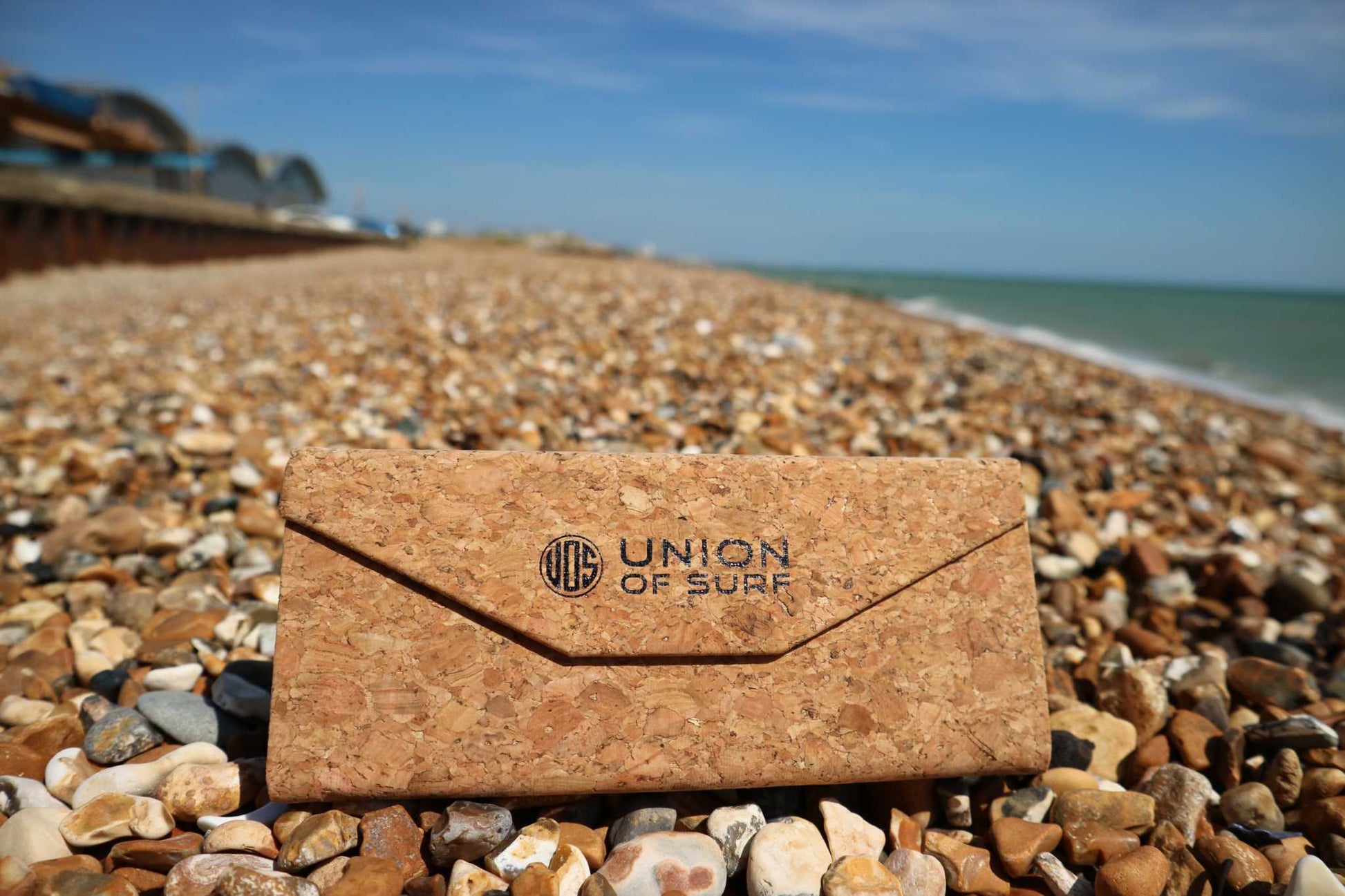 Cork sunglasses case with snap top and Union of Surf logo badge, brown cork.