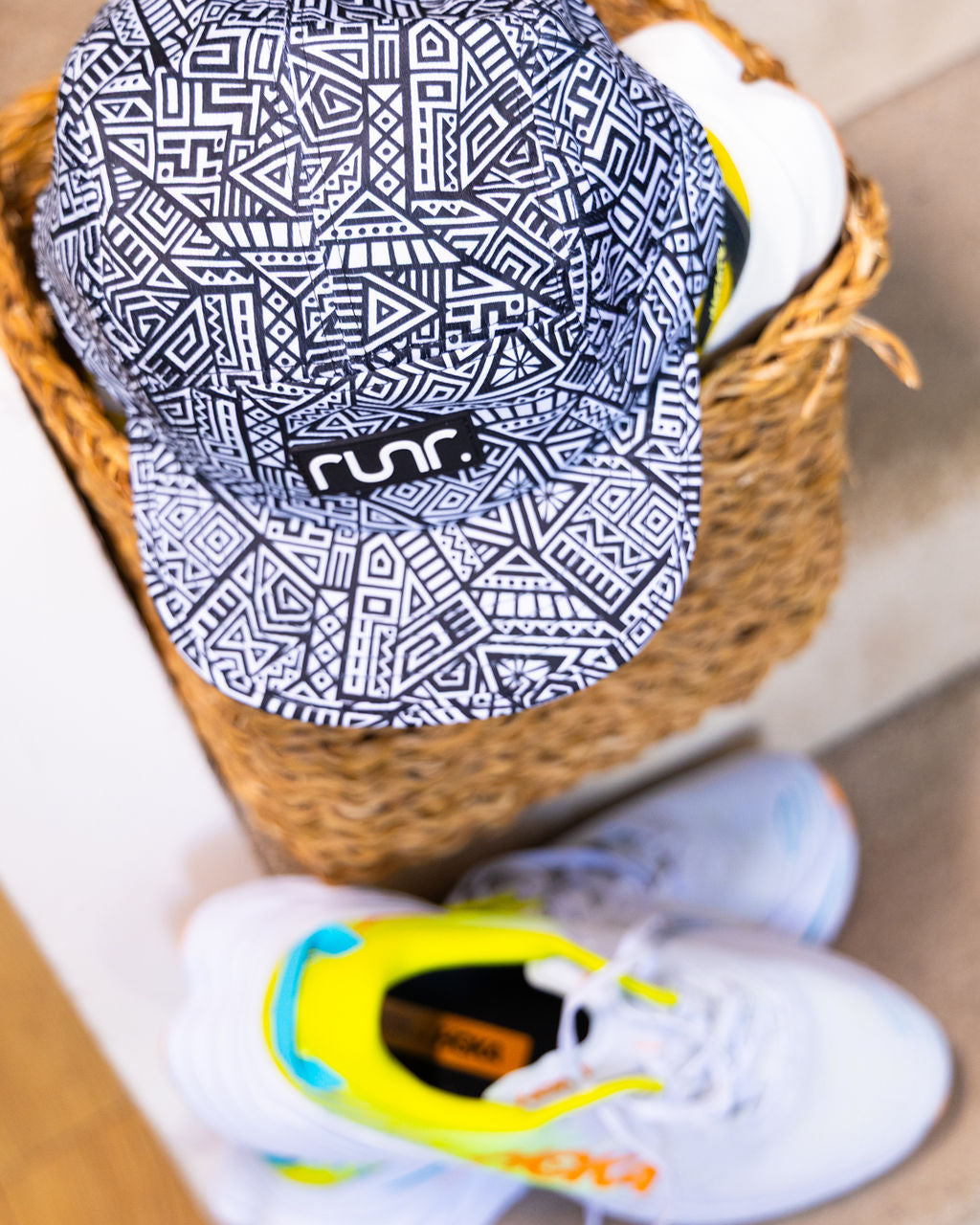 Navy and white geometric technical running hat with front logo patch