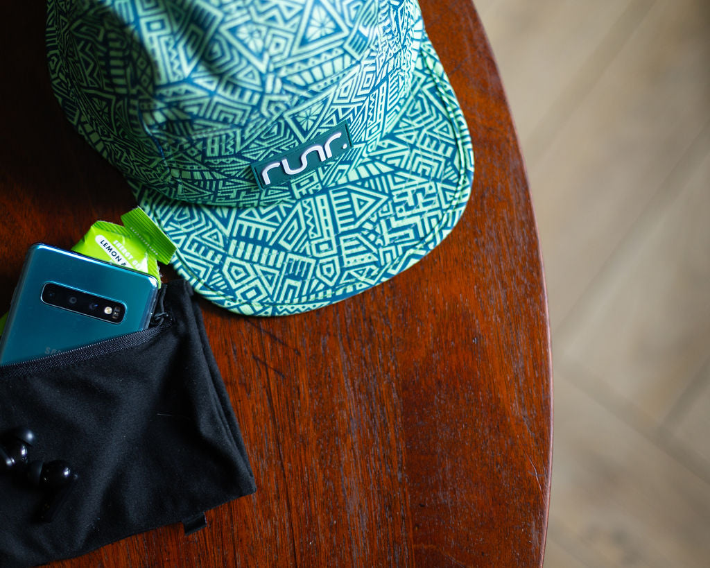 Geo-pattern running hat with black underside brim trim and runr logo