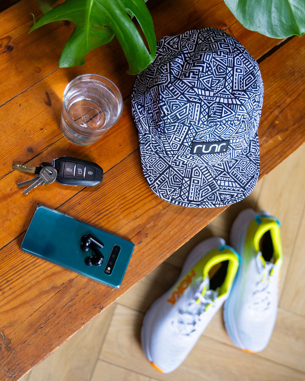 Navy and white geometric technical running hat with front logo patch